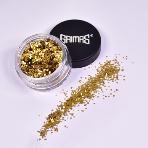 Støvet guld chunky glitter fra Grimas i klar beholder, ideel til ansigtsmaling og glitter tattoos.