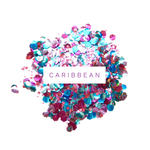 blå og lyserød bionedbrydelig glimmer spredt ud på hvid baggrund med teksten caribbean